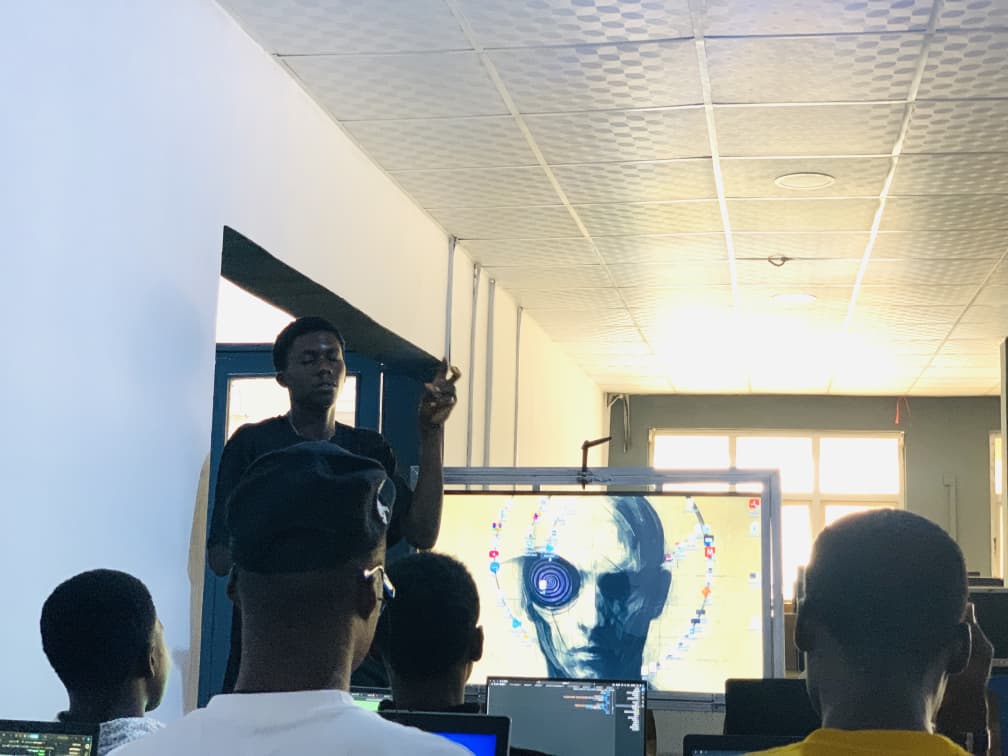 Young African innovators learning digital skills and coding at Tech2Grassroots Africa tech education program
